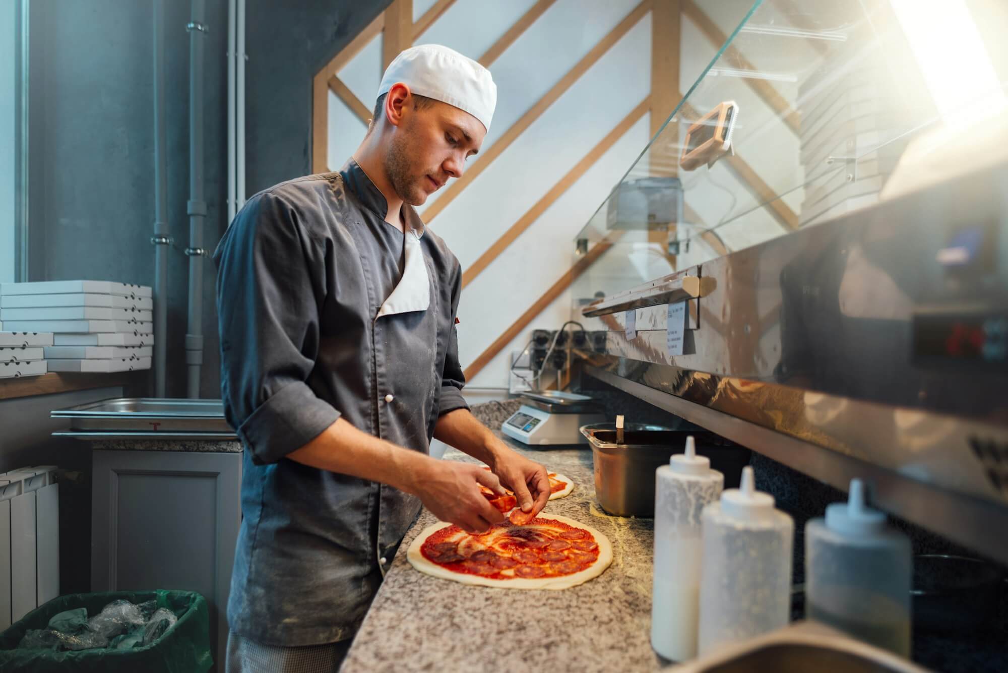 the-chef-prepares-pizza-catering-kitchen-work-.jpg